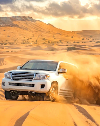4x4 vehicle dune bashing in the Dubai desert.