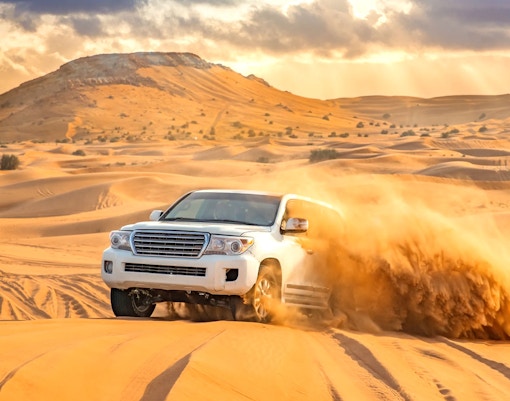4x4 vehicle dune bashing in the Dubai desert.