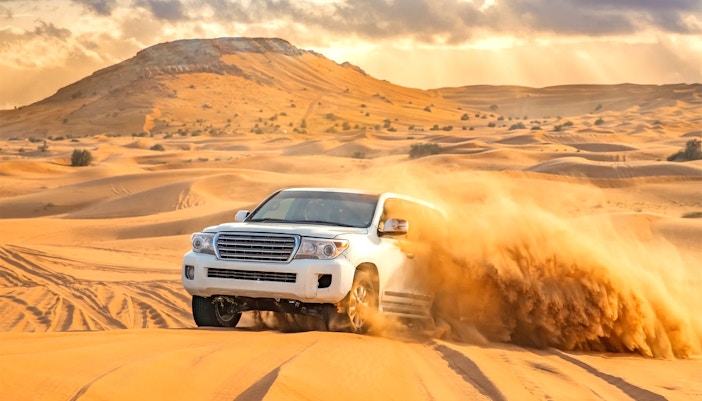 A 4x4 vehicle dune bashing in the Dubai desert
