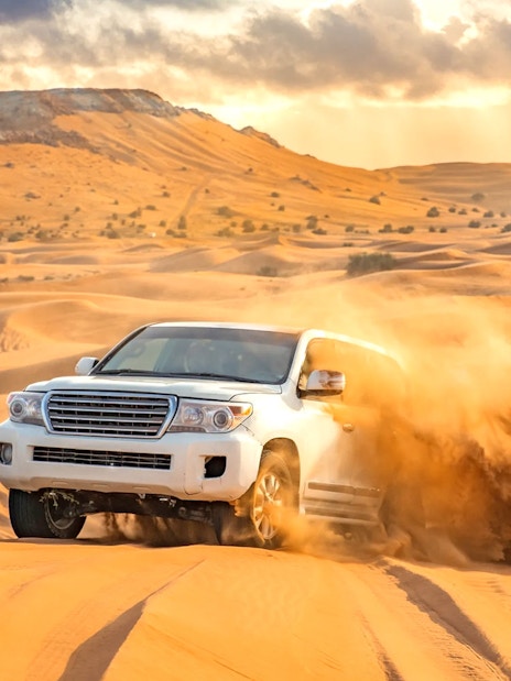 4x4 vehicle dune bashing in the Dubai desert.