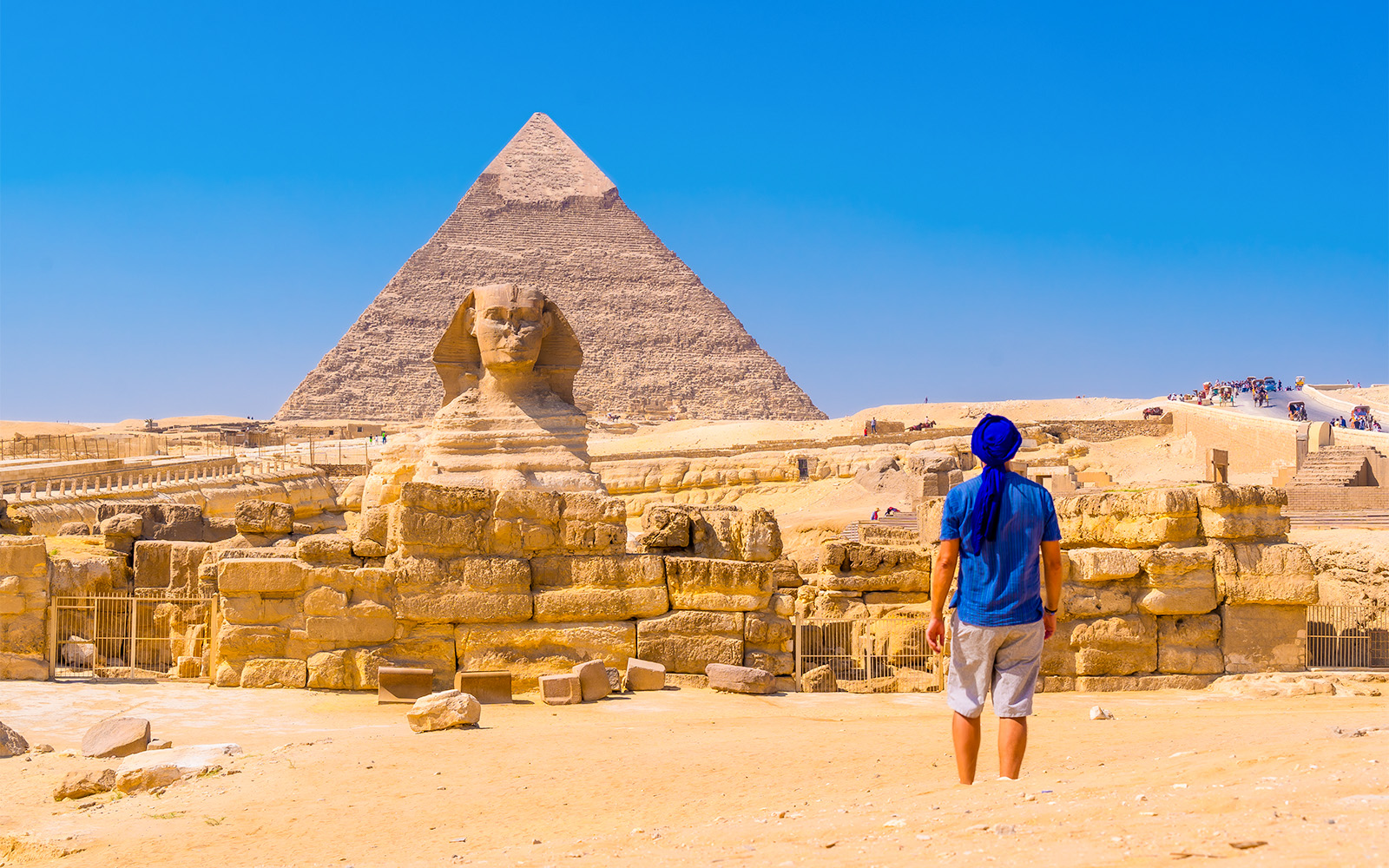 Person viewing the Sphinx and Pyramid of Giza in Egypt.