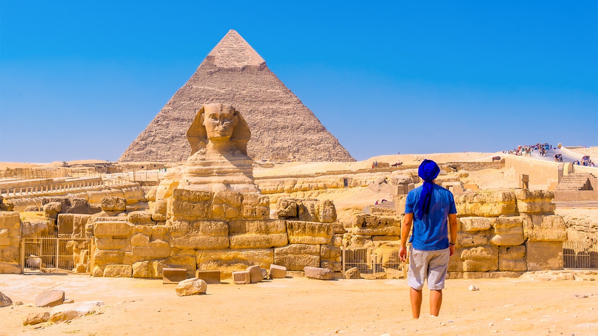 Person viewing the Sphinx and Pyramid of Giza in Egypt.