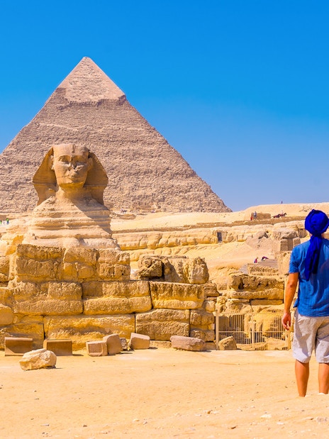 Person viewing the Sphinx and Pyramid of Giza in Egypt.