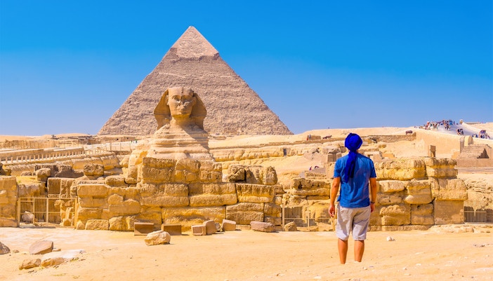 Person viewing the Sphinx and Pyramid of Giza in Egypt.