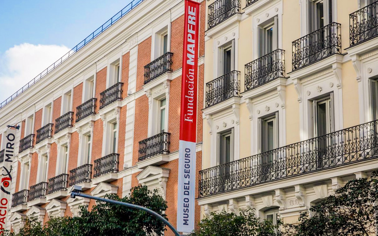 Exterior of Fundación MAPFRE building in Madrid with red and white signage.