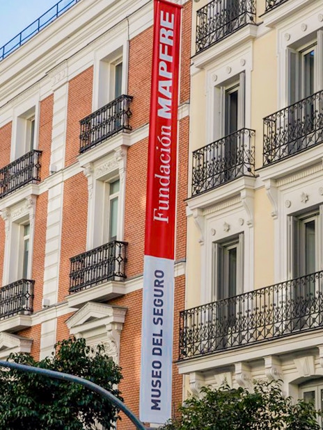 Exterior of Fundación MAPFRE building in Madrid with red and white signage.