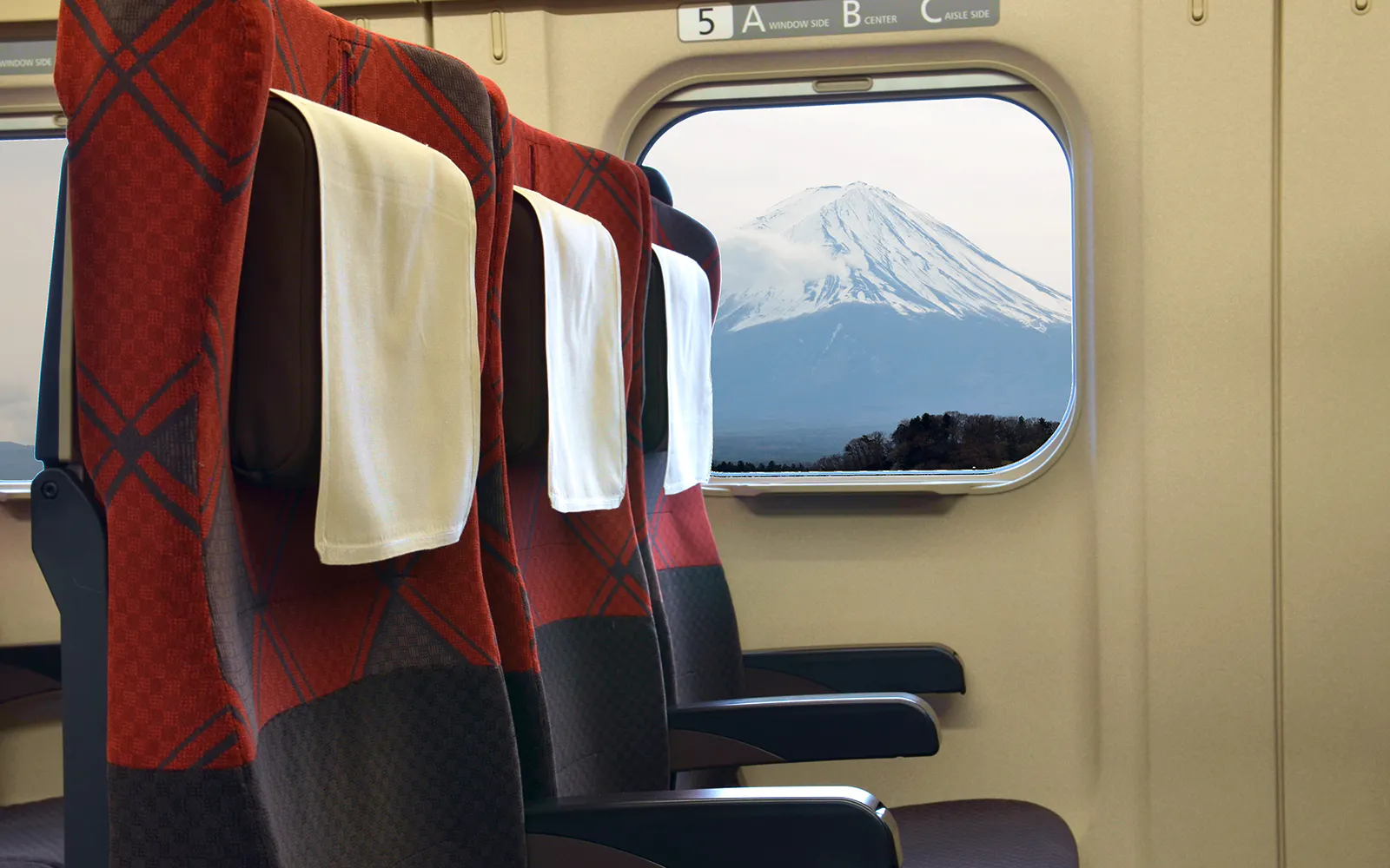 Shinkansen seat with Mount Fuji visible through the window in Japan.