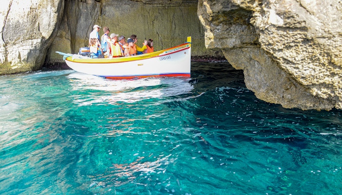 Tourist boat entering Blue Grotto - Tide-dependent mystery