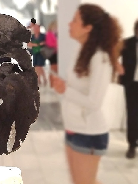Tourists viewing a sculpture at the Reina Sofia Museum in Madrid.