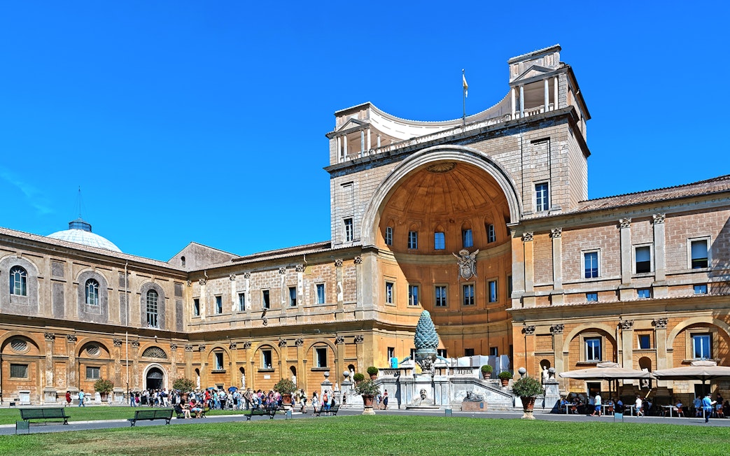 Belvedere Courtyard in Vatican City with tourists and architectural details.