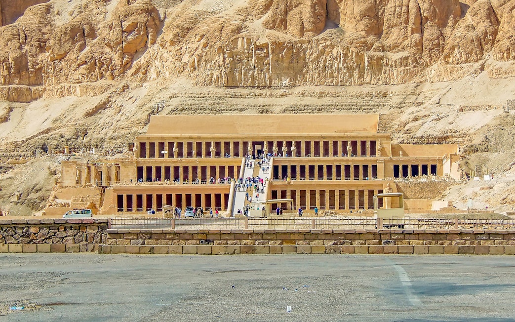 Luxor Temple entrance with tourists, showcasing ancient Egyptian architecture.