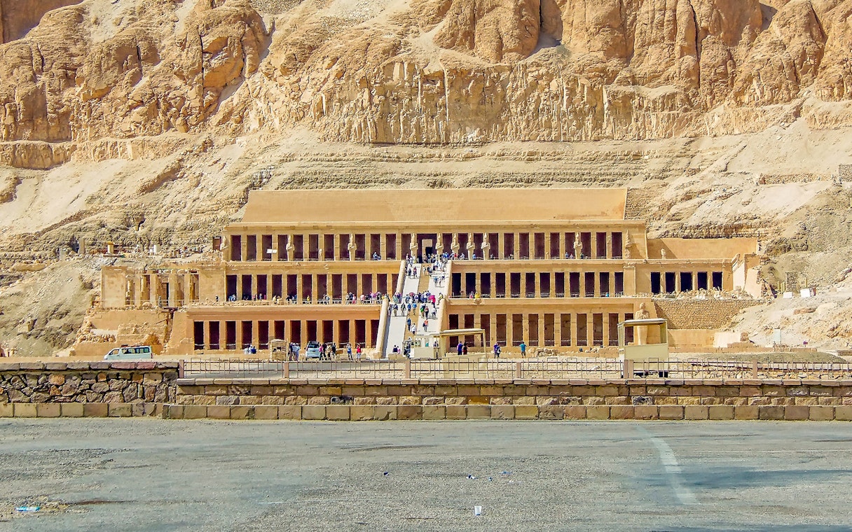 Luxor Temple entrance with tourists, showcasing ancient Egyptian architecture.