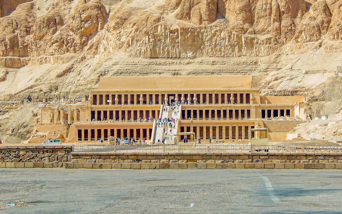 Luxor Temple entrance with tourists, showcasing ancient Egyptian architecture.