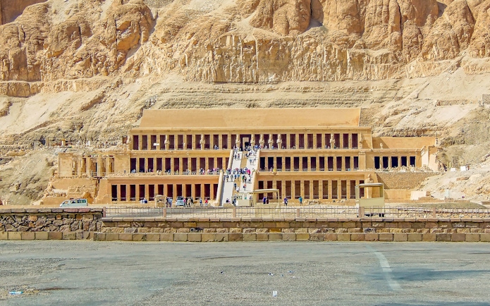 Luxor Temple entrance with tourists, showcasing ancient Egyptian architecture.