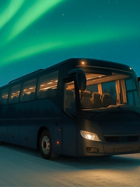 Bus under Northern Lights in Rovaniemi, Finland.