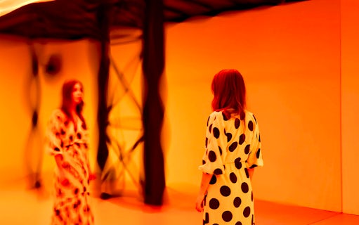 Guest viewing light installation at Light Art Museum exhibit.