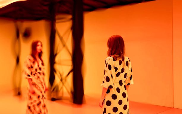 Guest viewing light installation at Light Art Museum exhibit.