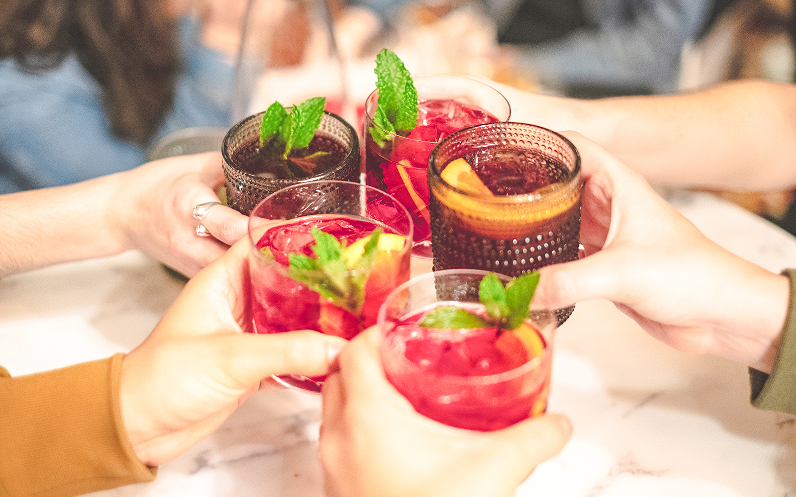 Cheers with sangria glasses at Montjuïc restaurant.