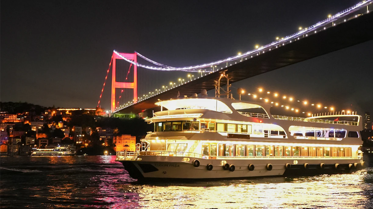 Bosphorus Bridge illuminated at night over the Bosphorus Strait, Istanbul.