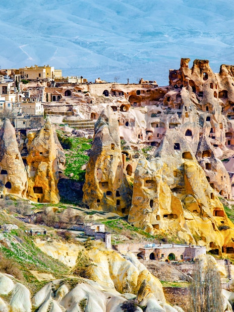 Fairy chimneys and ancient cave dwellings in Cappadocia, Turkey.