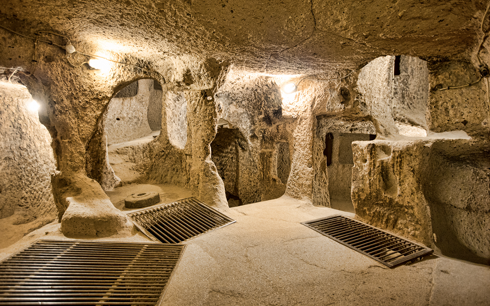 Maze of caves in Derinkuyu Underground City, Cappadocia, with stone walls and passageways.