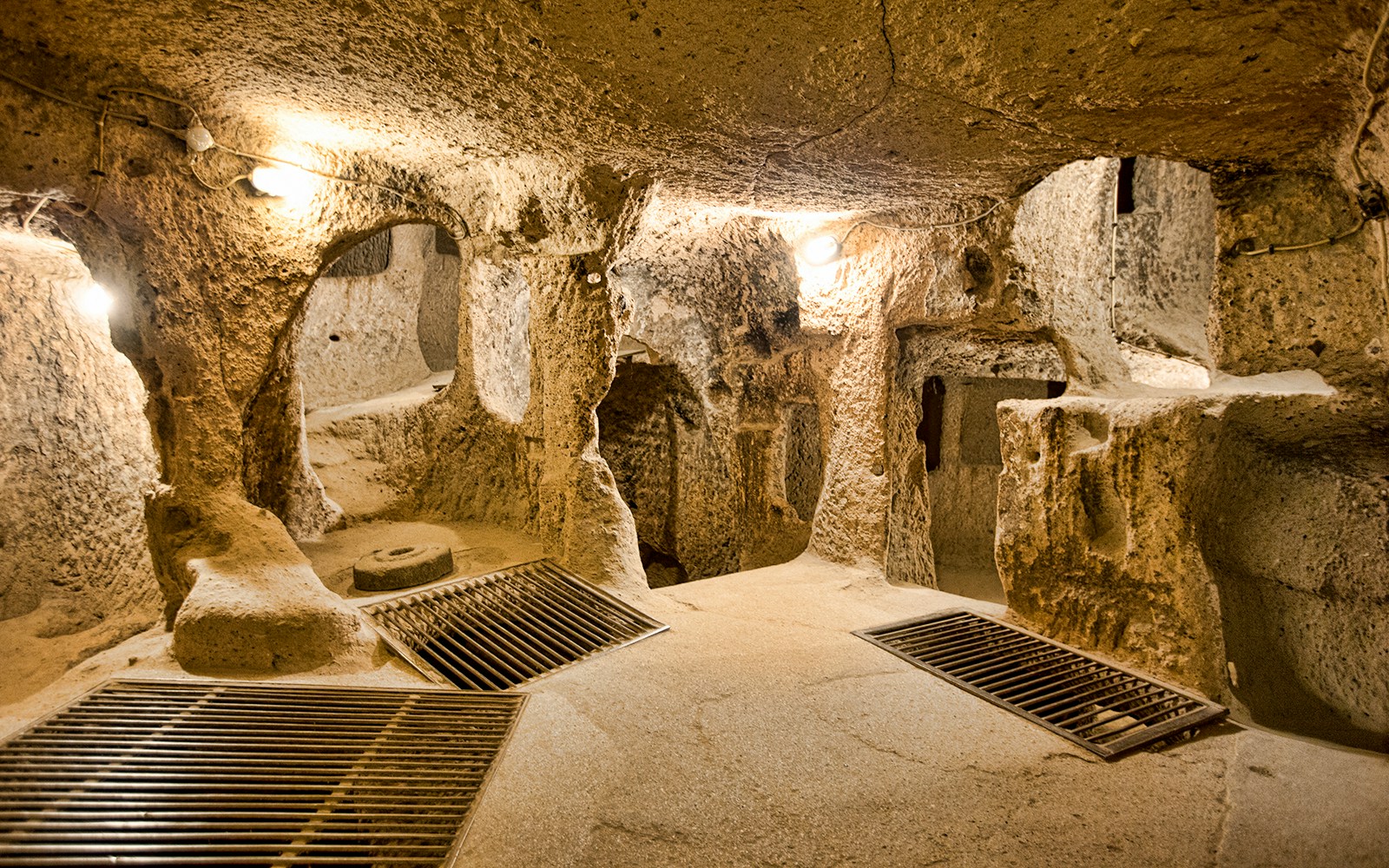 Maze of caves in Derinkuyu Underground City, Cappadocia, with stone walls and passageways.