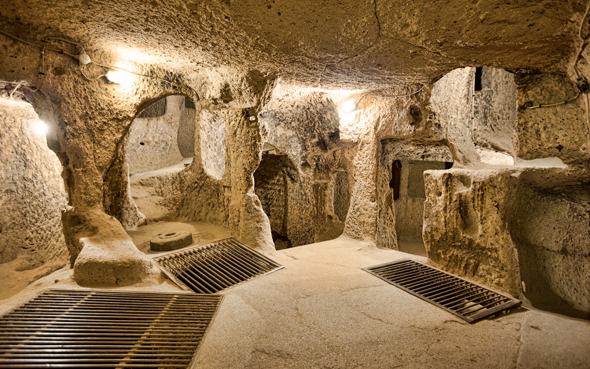 Maze of caves in Derinkuyu Underground City, Cappadocia, with stone walls and passageways.