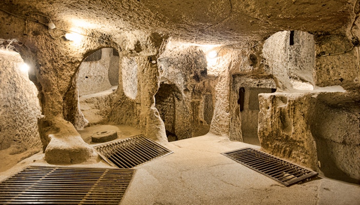 Maze of caves in Derinkuyu Underground City, Cappadocia, with stone walls and passageways.