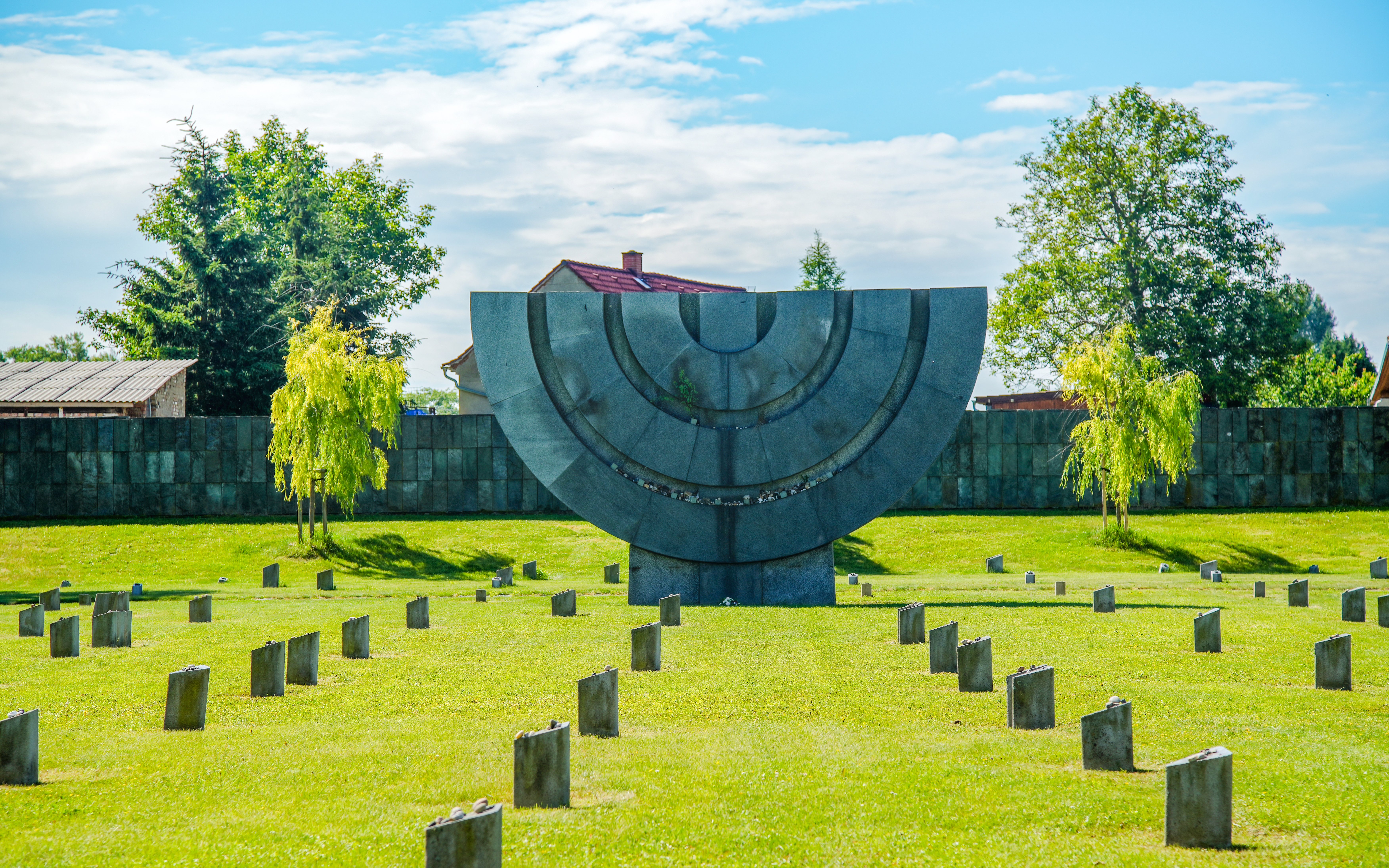 Memorial sculpture and gravestones at Terezín Concentration Camp, Czech Republic.