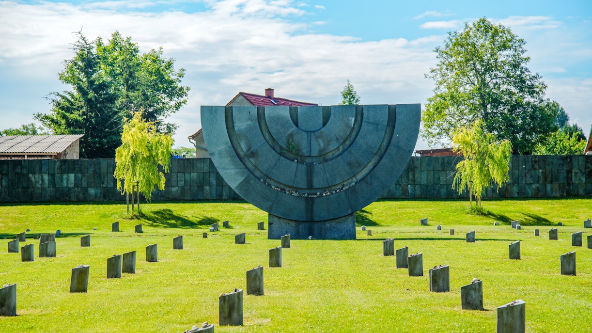 Memorial sculpture and gravestones at Terezín Concentration Camp, Czech Republic.