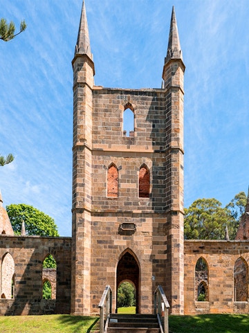 Port Arthur Historic Site church ruins with stone arches and spires.
