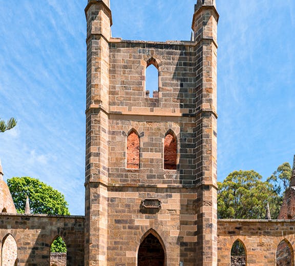 Port Arthur Historic Site church ruins with stone arches and spires.