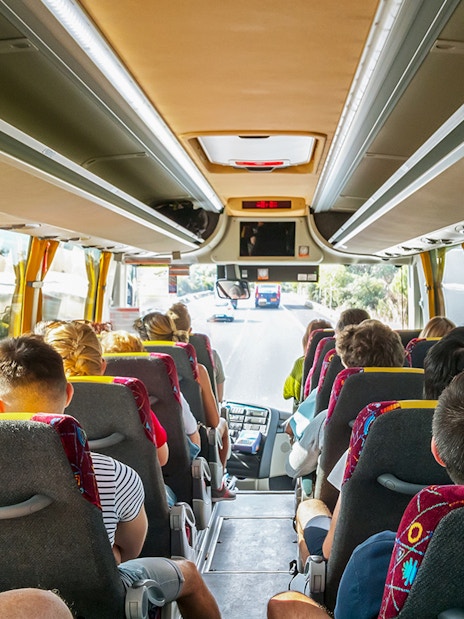 Tourists on a bus heading to Cinque Terre from Florence.