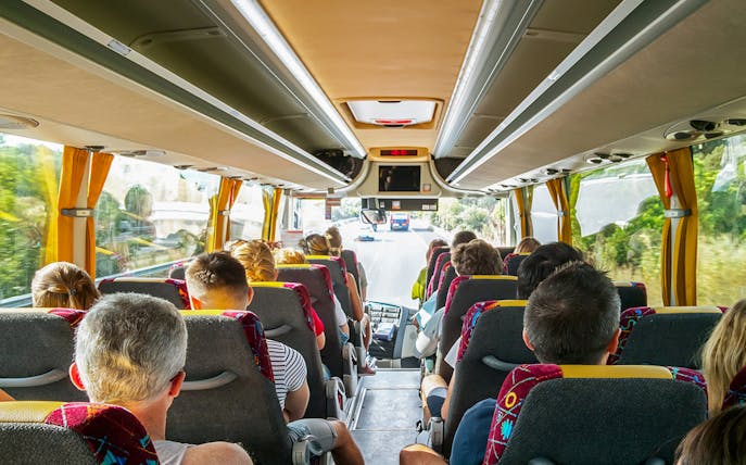 Tourists on a bus heading to Cinque Terre from Florence.