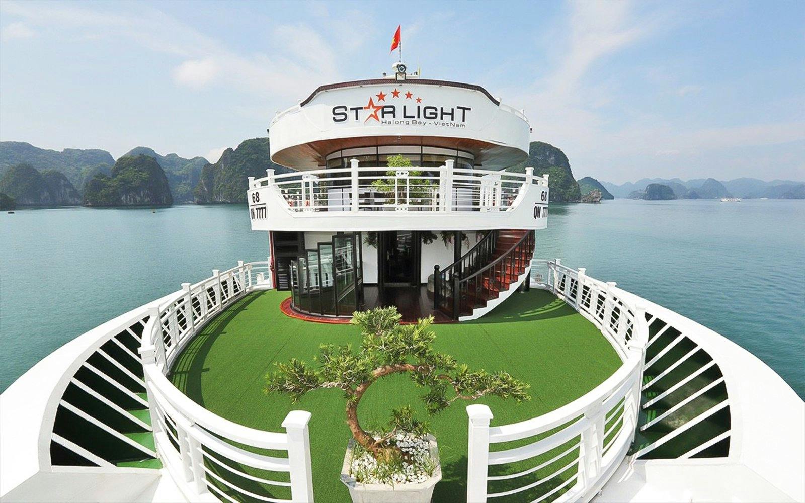 Starlight Cruise deck with scenic view of Halong Bay, Vietnam.