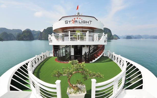 Starlight Cruise deck with scenic view of Halong Bay, Vietnam.