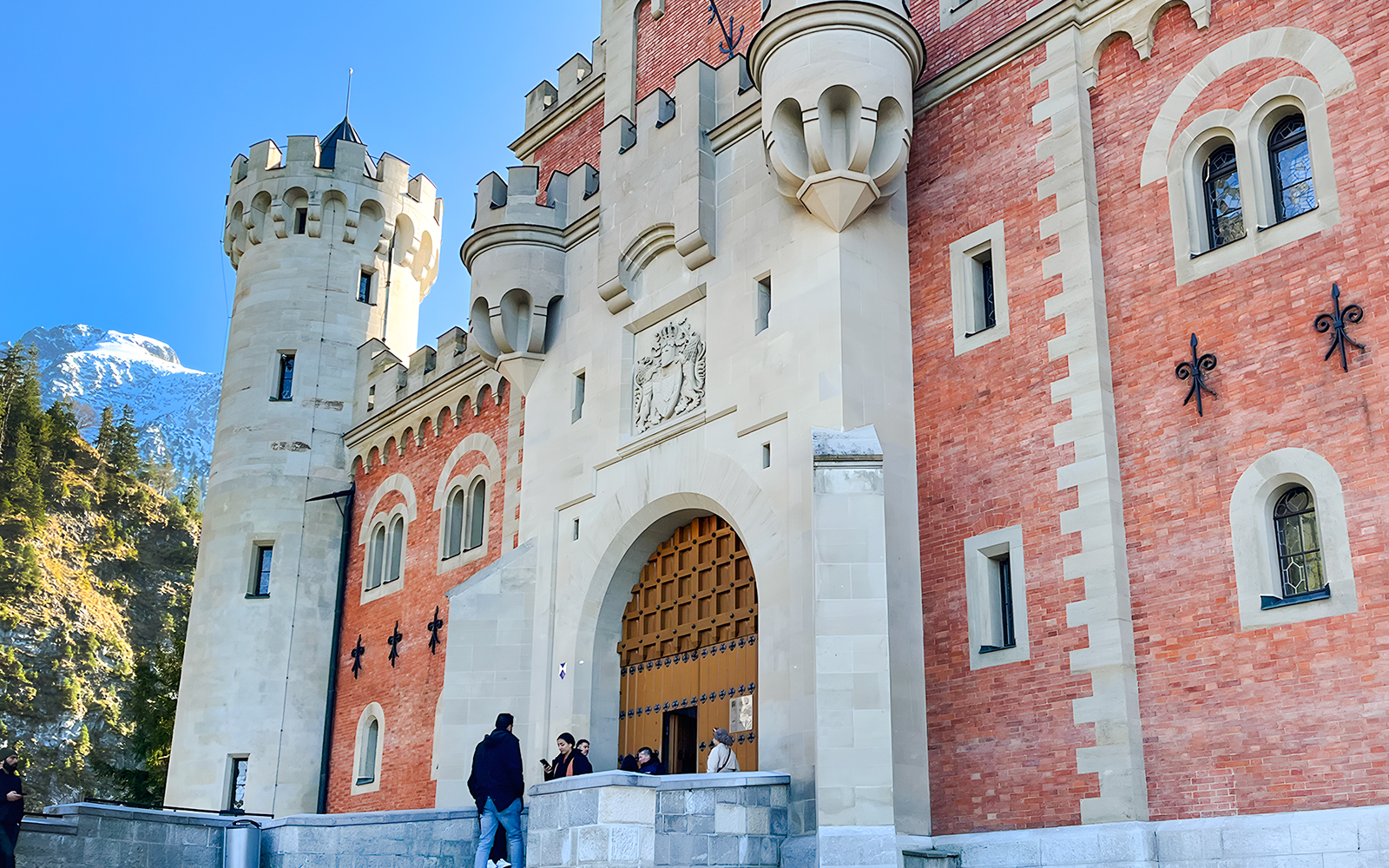 Neuschwanstein Castle entrance with visitors, Bavaria, Germany.