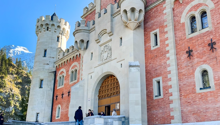 Neuschwanstein Castle entrance with visitors, Bavaria, Germany.