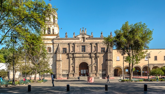 San Juan Bautista Parish facade with bell towers in Coyoacan, Mexico.