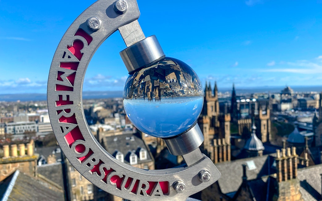 Globe exhibit reflecting Edinburgh skyline at Camera Obscura & World of Illusions.