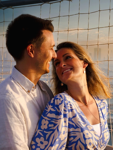 Couple enjoying view from The Dubai Balloon at Atlantis, overlooking Palm Jumeirah.