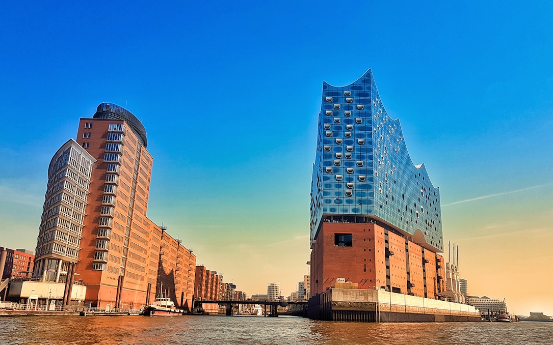 Elbphilharmonie and surrounding buildings in HafenCity, Hamburg, viewed from the water.