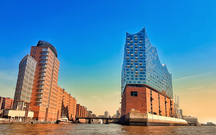 Elbphilharmonie and surrounding buildings in HafenCity, Hamburg, viewed from the water.