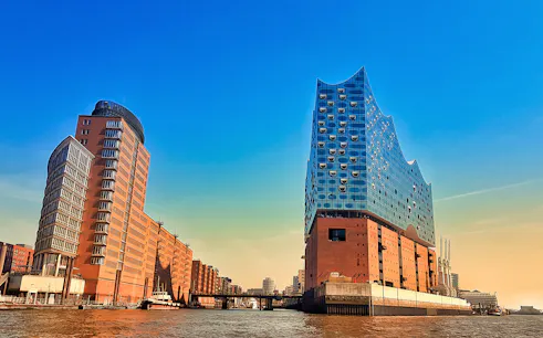 Elbphilharmonie and surrounding buildings in HafenCity, Hamburg, viewed from the water.