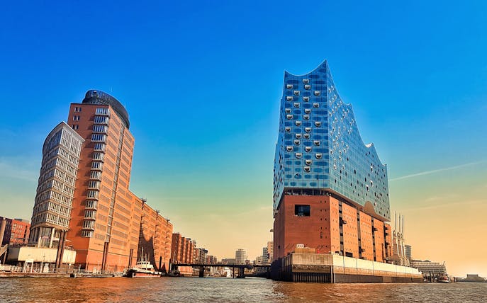 Elbphilharmonie and surrounding buildings in HafenCity, Hamburg, viewed from the water.