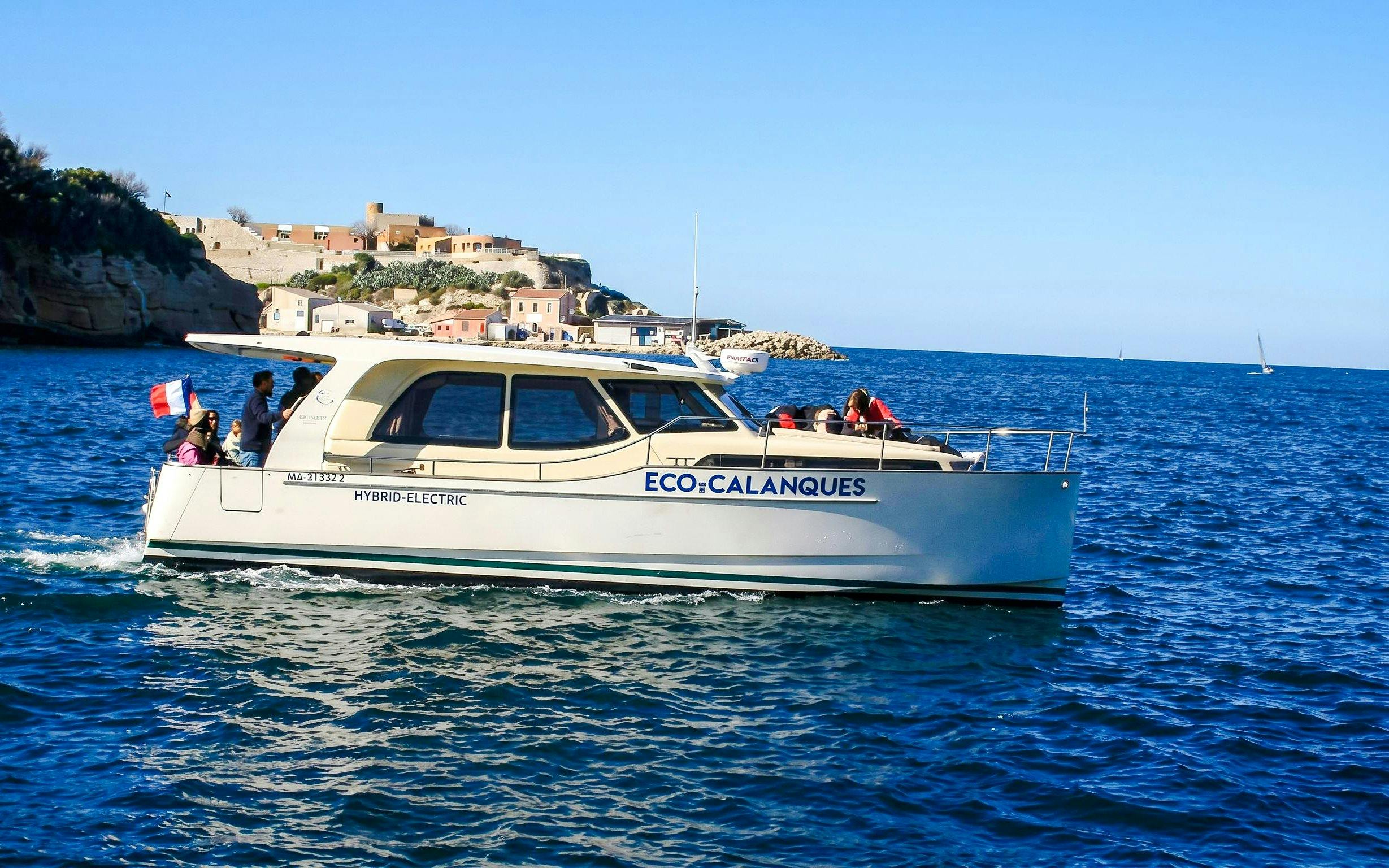 Hybrid boat touring Frioul Archipelago with Châteaux d’If in background.