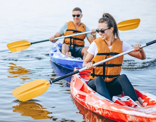 Couple kayaking on a river