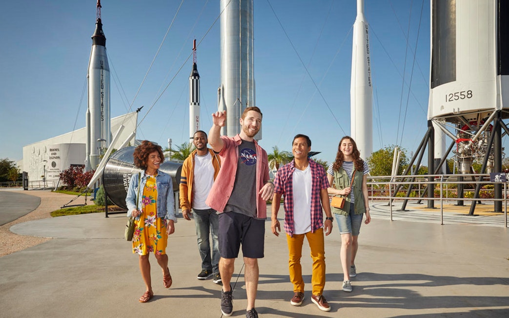 Visitors walking among rockets at the Rocket Garden, Kennedy Space Center.