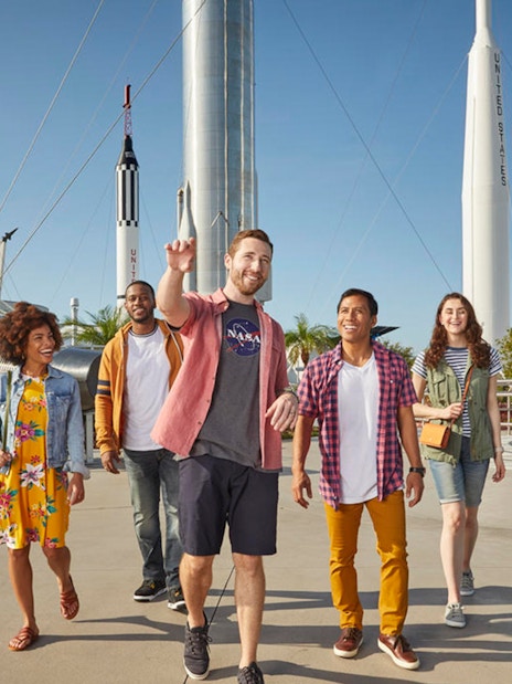 Visitors walking among rockets at the Rocket Garden, Kennedy Space Center.