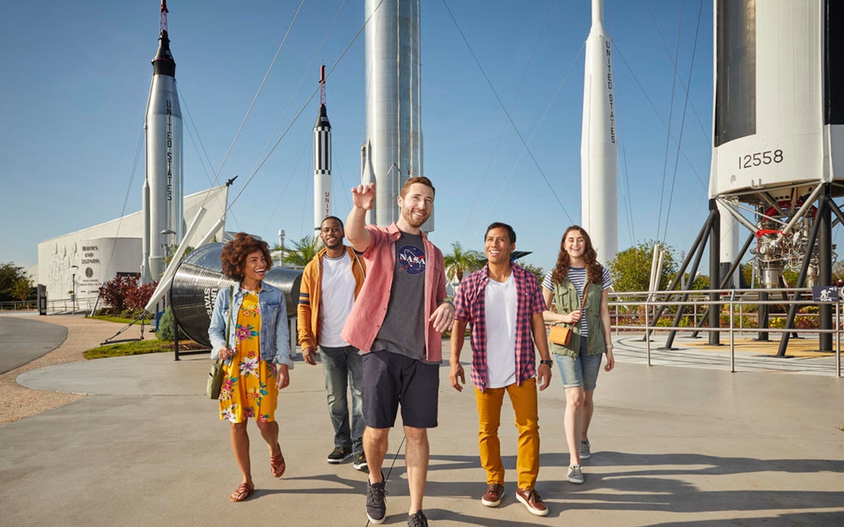 Visitors walking among rockets at the Rocket Garden, Kennedy Space Center.